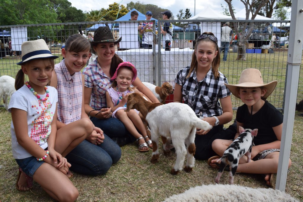Lily Horne, Jade Moon, Brianna Moon, Lexi Horne, Belle Horne and Rikkie Moon feed the baby animals from Kims Itty Bitty Mobile Animal Farm. 